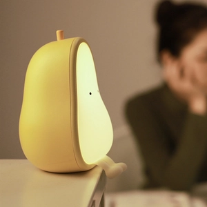 Cute pear-shaped LED night light with silicone body and dangling legs for bedroom decor
