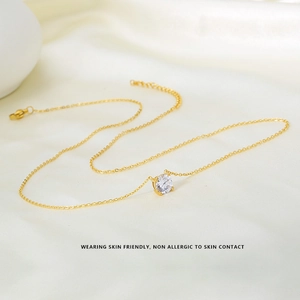 Close-up of a 7mm round cubic zirconia necklace with a four-prong gold chain setting