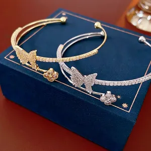 Elegant double-layered open cuff bracelet with zircon butterfly and clover charms