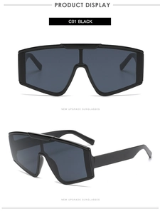 Front and side view of black oversized one-piece shield sunglasses with wide frame design