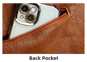 Detail of rear zipper pocket on brown lychee texture leather tote with smartphone inside