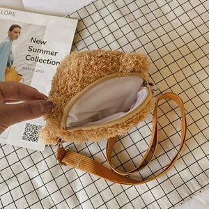 Brown plush bear crossbody bag with yellow woven strap and zip closure for women