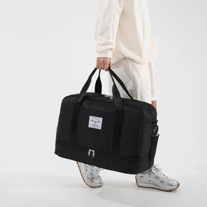 Black dry-wet separated gym bag with embossed texture and bottom shoe compartment