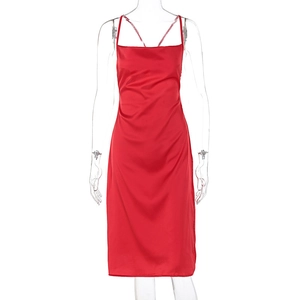 Detail of red satin dress featuring a cowl neckline and slim fit silhouette