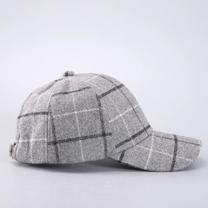 Detailed view of the thick wool blend fabric and houndstooth pattern on the baseball cap