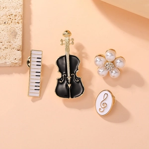 Detailed set of music themed brooches featuring piano, violin, pearl flower and note