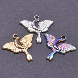 Detailed view of moon moth pendants in silver, gold, and iridescent finishes for DIY jewelry