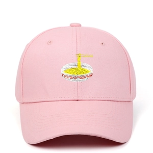 Macro detail of high-quality yellow ramen embroidery on pink cotton canvas baseball cap