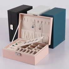 Green suede double-layer jewelry box set showing necklace hooks and ring slots