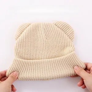 Close-up showing the high elasticity and soft ribbed texture of the baby bear ear hat