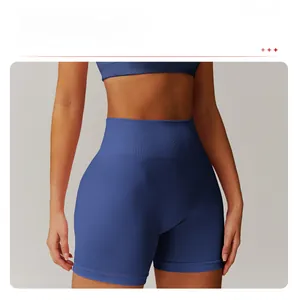 Detail of high waisted navy yoga shorts featuring a wide ribbed compression waistband