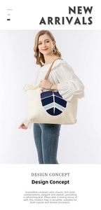 Close-up of white woven tote bag featuring blue floral embroidery and fringe trim detail