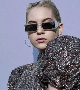 Fashionable square-frame sunglasses on a model highlighting modern chic street style