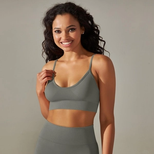 Detailed close-up of dark grey seamless ribbed knit sports bra with thin shoulder straps