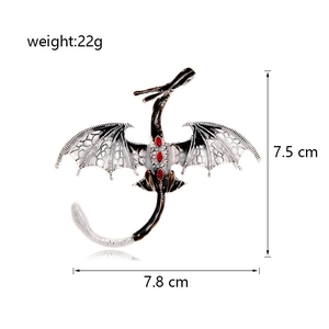 Detailed size chart of a vintage dragon brooch with red gemstones and enamel wings