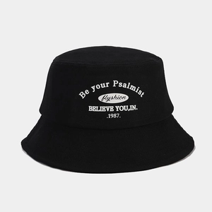 Detail of black cotton bucket hat featuring white Be your Psalmist printed graphics