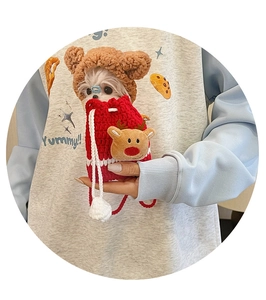 Close-up of red crochet Christmas reindeer bag for small dogs and puppies