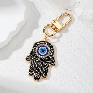 Detail view of Hamsa Hand keychain with Evil Eye enamel and sparkling rhinestones