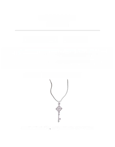 Macro detail of silver zircon key pendant necklace showing technical specs and chain length