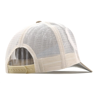 Detail view of the breathable mesh back and plastic snap closure on the beige trucker hat