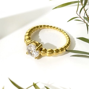 Minimalist 18K gold plated stainless steel ring with round zircon and beaded band texture