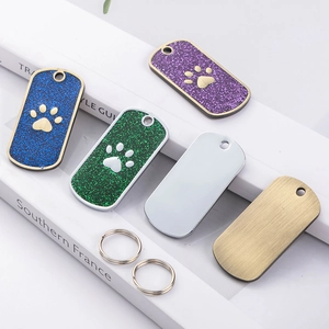 Glitter and metallic dog paw ID tags in various colors for pet collars with split rings