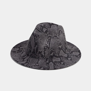 Detail shot of the snakeskin patterned wool felt fedora with a wide brim and flat top