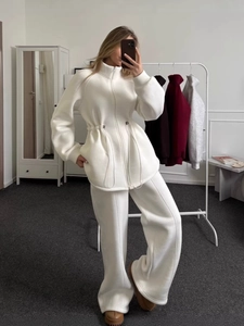 Women's white lounge tracksuit set featuring a zip-up drawstring waist hoodie and wide-leg pants