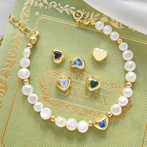 14k gold filled pearl bracelet with colorful heart charms and sparkling zircon inlays
