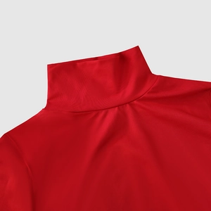 Close-up of the elegant high-neck collar and smooth red fabric texture on the evening dress
