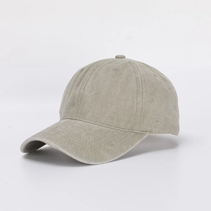 Detail of washed cotton texture and reinforced stitching on a khaki baseball cap