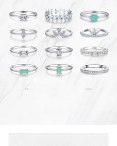 Collection of twelve S925 sterling silver rings with emerald and white zircon stones