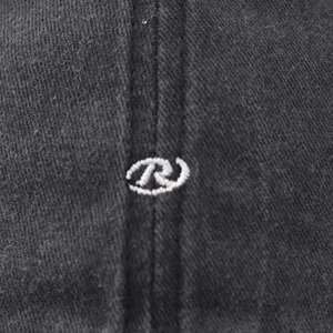 Black washed cotton baseball cap featuring a white embroidered letter R circular logo