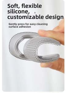 Flexible grey silicone pet hair remover brush showing high elasticity and soft bristles