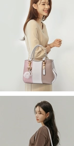 Three-tone panel handbag featuring pink faux fur pompom and metal bow pendant details