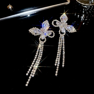 Detailed view of silver butterfly tassel earrings with sparkling clear cubic zirconia