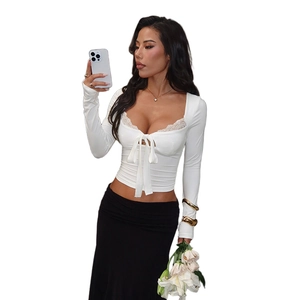 Slim fit white long sleeve top with delicate lace neckline and front bow tie detail