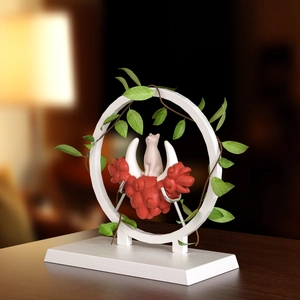 Artistic moon cloud cat resin mold featuring hanging vine leaves on a circular base stand