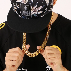 Close-up of a chunky 18K gold plated stainless steel Cuban link chain for men in hip-hop style