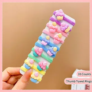 Close-up of 10-piece set of colorful cupcake charms on elastic nylon mini hair ties