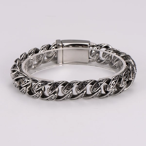 Vintage men's stainless steel totem bracelet with intricate carvings and retro silver finish