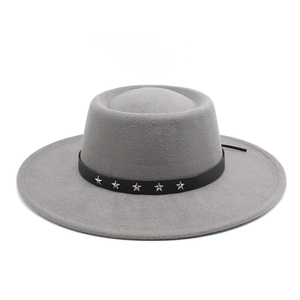 Detail of grey wide brim pork pie wool hat with black star-studded leather band