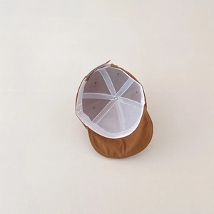 Detailed interior of 100% cotton baby cap showing breathable lining and soft structure