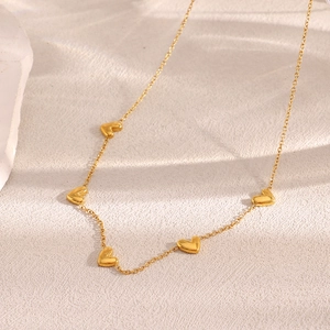 Detail view of 18K gold plated stainless steel O-chain with delicate mini heart pendants