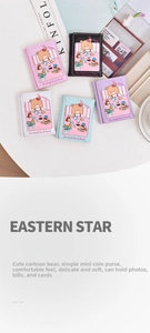 Flat lay of cute cartoon bear mini wallets in five colors on a Kinfolk lifestyle background