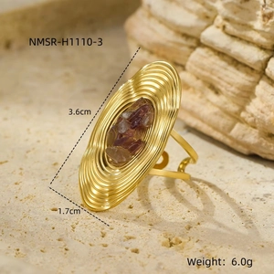 Detailed view of oval vintage ring with purple stones and dimensions of 3.6cm by 1.7cm