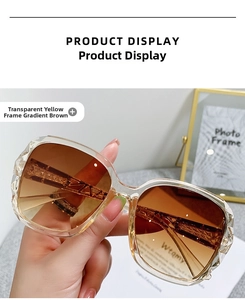 Detailed close-up of oversized square sunglasses with carved temples and gradient lenses
