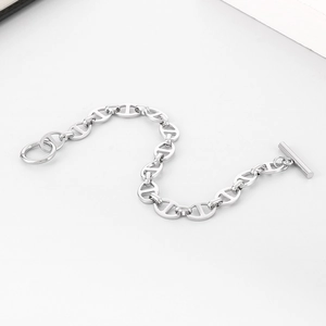 Detail of silver stainless steel anchor chain bracelet with T-bar clasp closure