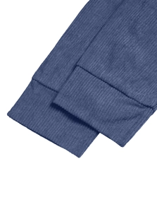 Detailed macro view of the blue corduroy texture and ribbed cuffs on the casual sweatshirt