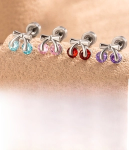 Detail view of cherry earrings with crystal bows and 0.8x6mm screw back studs